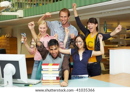 Library staff at university cheering at counter