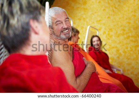 Two senior people talking to each other in a Spa