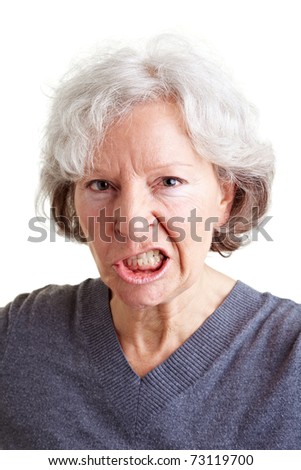 Angry old senior woman showing her teeth