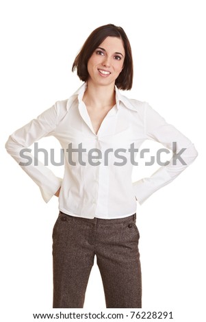 Smiling young business woman with her arms akimbo