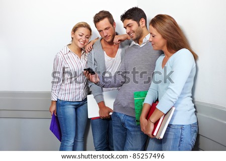 Friends in university looking at a smartphone