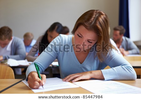 Young woman taking test in job assessment center
