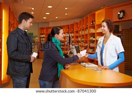 Waiting queue with customers in a pharmacy with pharmacist