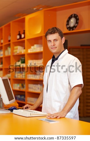 Pharmacist serving behind the counter of a pharmacy