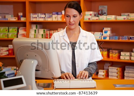 Pharmacist making an online order in a pharmacy
