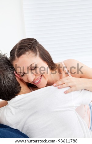 Elderly happy woman embracing her man in bed