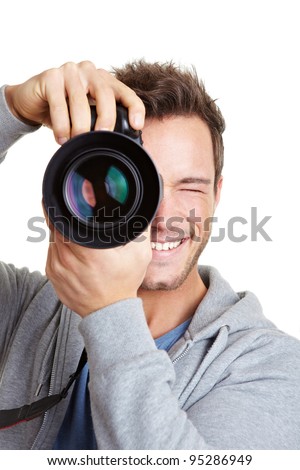 Young photographer taking pictures with digital camera Young photographer taking pictures with digital camera