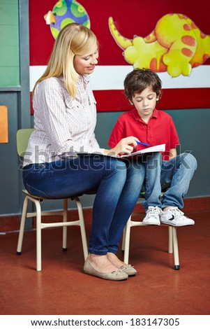 Elementary school student learning in private lessons with teacher