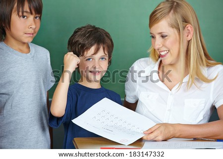 Student cheering after getting good grade in elementary school