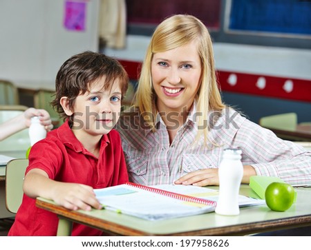 Teacher and student in classroom of an elementary school
