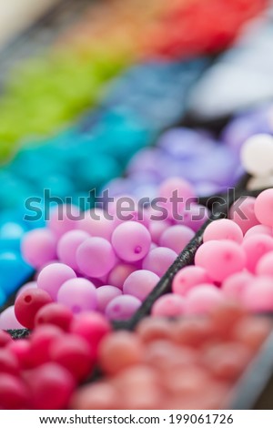 Selection of many colorful pearls in a crafts store