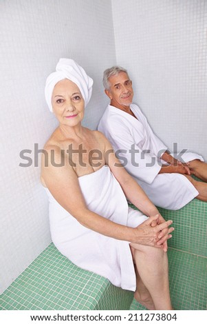 Old woman and man relaxing after sauna session in a spa