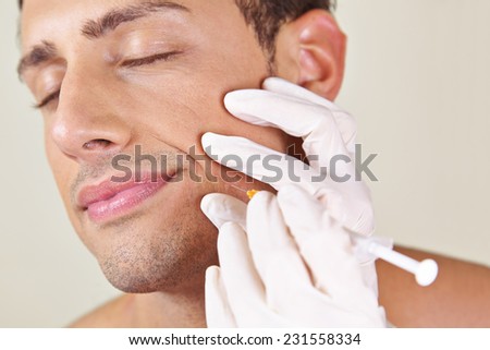 Man in a beauty clinic getting wrinkle treatment near his mouth