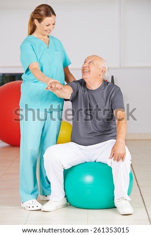 Old man during rehab in physiotherapy in a nursing home