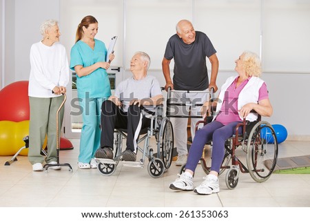 Group of senior people with and without disabilities with geriatric nurse at physiotherapy