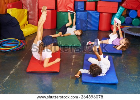Group of children exercising in physical education in preschool