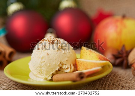 Scoop of cinnamon ice cream with apple for dessert at christmas