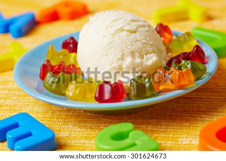 Vanilla ice cream with gummy bears at a children\'s birthday party