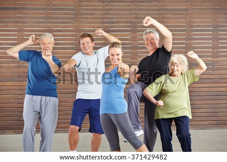 Active seniors with power and energy in gym learning self defense