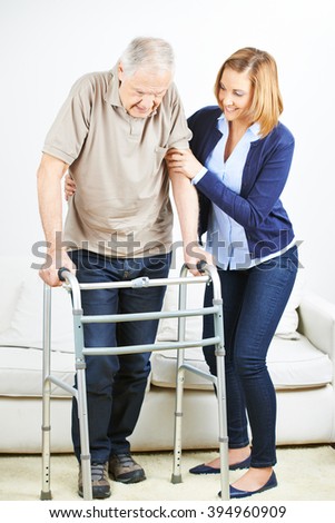 Senior man at physiotherapy at home with a physiotherapist