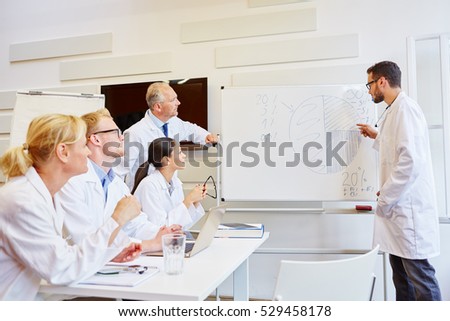 Doctors presenting results in medical seminar