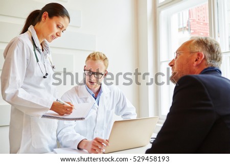 Doctors and patient talking about therapy