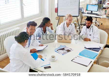 Group of doctors in medical school discussing and learning as team