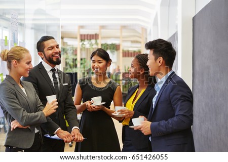 Team making small talk in their coffee break