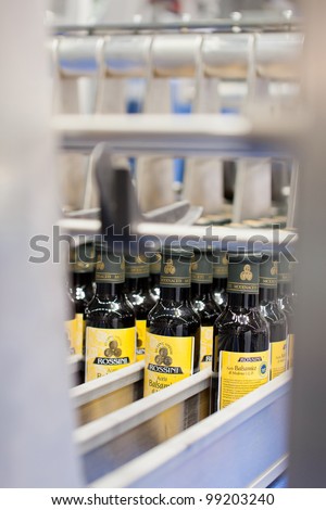 COLOGNE, GERMANY - MARCH 27 : New olive oil packing machine on display at Clevertech booth at the ANUGA FoodTec industry trade show in Cologne, Germany on March 27, 2012.