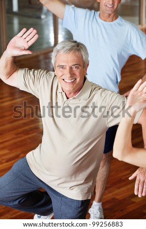 Dancing elderly man in fitness center class