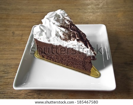 chocolate mousse cake on wood background