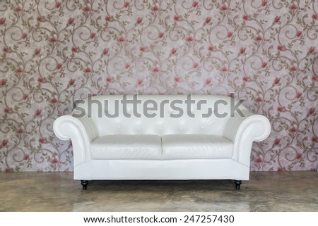 Old styled white leather sofa