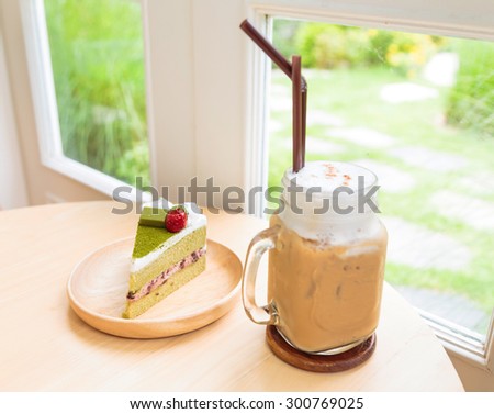 Ice coffee with japanese matcha green tea cake red bean cream ,focus on cake