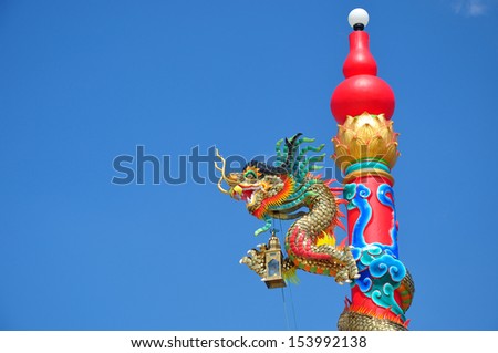 Statue of dragon in clear blue sky