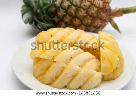Sliced pineapple on  a dish