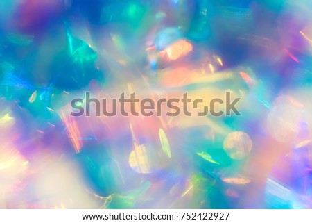 Abstract electro modern futuristic night club party texture background image of deep cosmic space nebula with vivid turquoise purple and yellow bokeh light gleaming effect and shiny bright neon glow