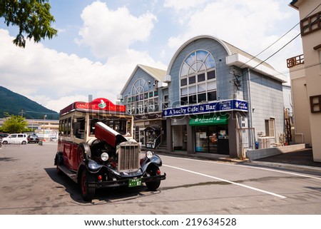 Yufuin,Oita,Japan - July 25, 2014 : The Classic car is in main street of Yufuin,Oita,Japan on July 25, 2014.Yufuin,Oita,Japan