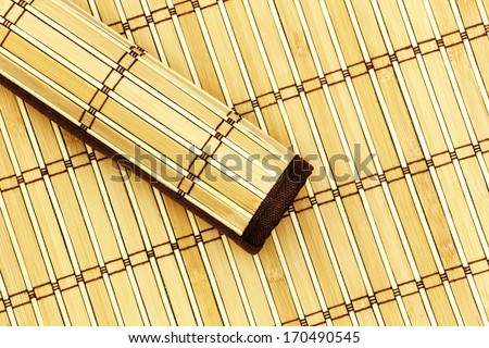 Rolled bamboo mat on a bamboo mat