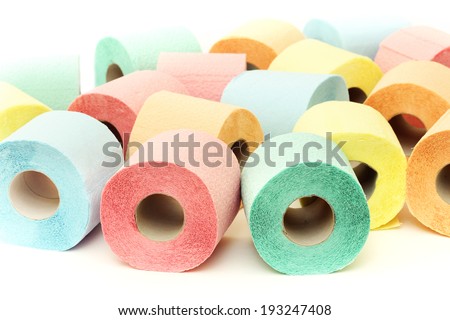 A lot of colorful toilet paper rolls on a white background