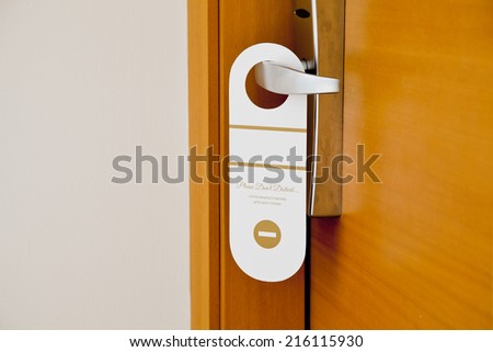 Do not disturb card on the door with free writable place on it