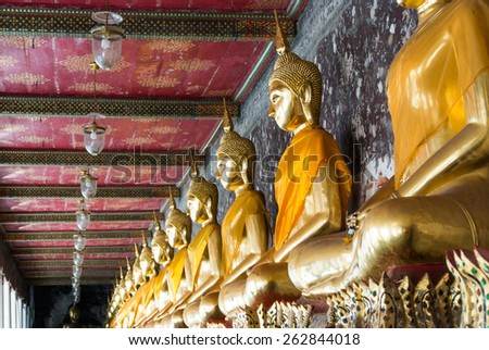 Golden Buddhist statues at Wat Suthat Temple in Bangkok, thailand