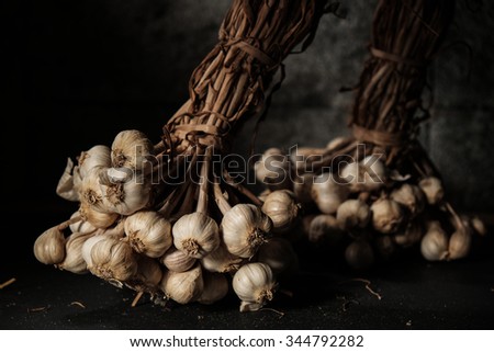 Still Life of Garlic with Dark Background, Moody Natural Lighting, Selective Focus