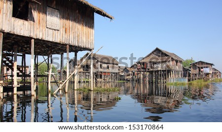 INLE LAKE, MYANMAR - FEBRUARY 05, 2013: Stilt houses of Lake Inle. The lokal people are living, fishing and growing their vegetables on the lake.