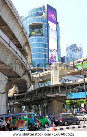 BANGKOK, THAILAND - MARCH 23, 2013: In the business district of Bangkok the skytrain tracks run high in the air between the department stores.