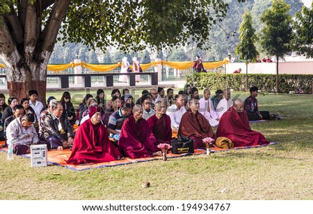 BODHGAYA, INDIA - FEBRUARY 25, 2014: A Meditation Group led by buddhist monks near Mahabodhi temple, India
