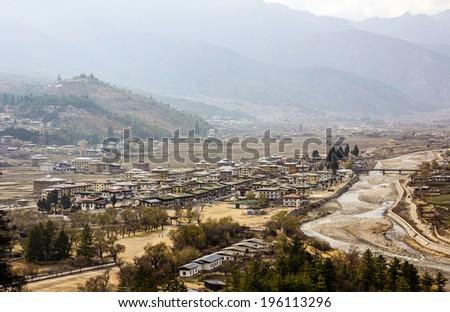 A bird\'s eye view of the city of Paro, Bhutan. All houses are built in traditional bhutanese stile.