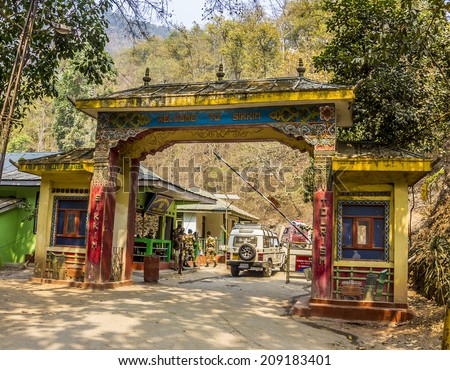 The gate at the border between West-Bengal, India and Sikkim, India. (faces and logos blurred)