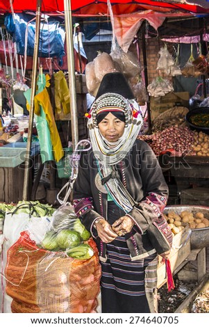 KENG TUNG, MYANMAR - JANUARY 27, 2015: Woman of the Akha tribe on the market of Keng Tung in the north of Myanmar