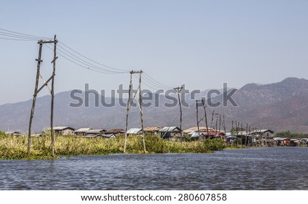 stilt house village with electricity line at Inle lake, Myanmar