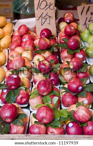 Fresh rosy red apples for sale on a market stall in china